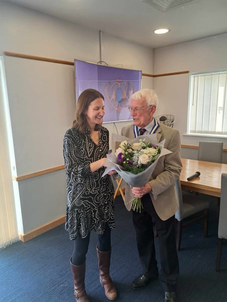 Eddie Fryer, Probus Club vice-president presenting Katie King with a bouquet following her recent talk to the club members