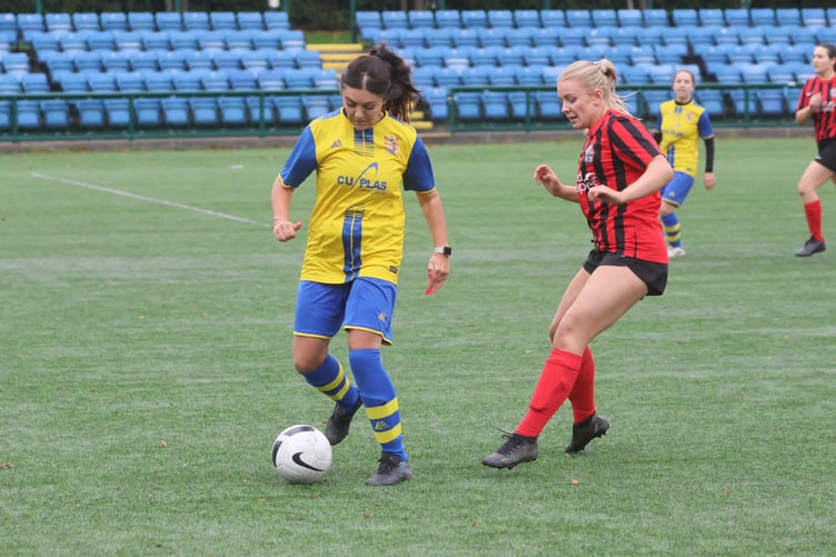 Onchan's Courtney Goldsmith and Malew's Abi Sutterby (Photo: Paul Hatton)