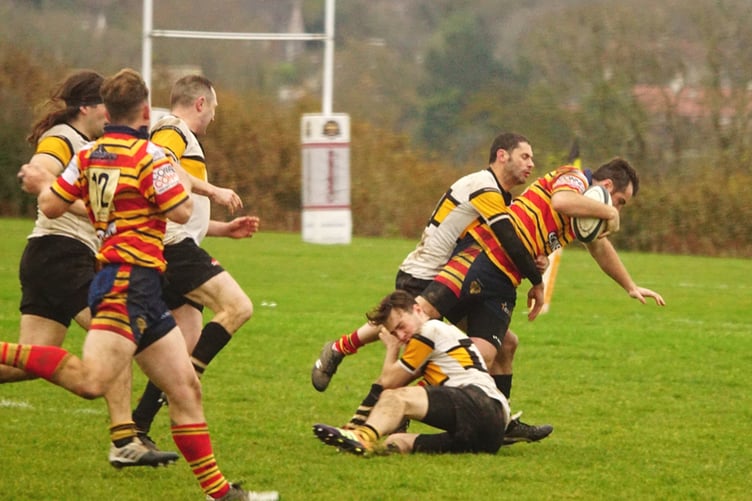 It takes two – Vagabonds duo Rob Pease and Regan Williams struggle to bring down Bury’s Sam Norris during the two sides' recent league meeting (Photo: John Liver/Mumble's Pics)