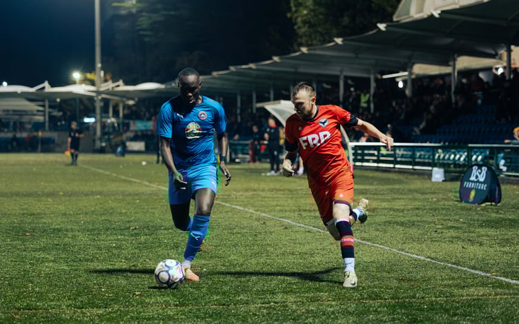 Form man Luke Booth (right) in action for FC Isle of Man against Abbey Hey at the Bowl on Saturday (Photo: David Lovelady)