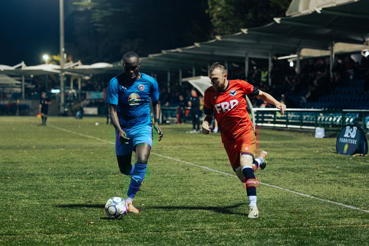 Form man Luke Booth (right) in action for FC Isle of Man against Abbey Hey at the Bowl on Saturday (Photo: David Lovelady)