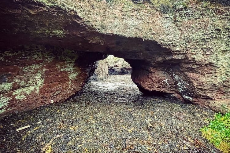 An archway eroded into the rocks at Langness