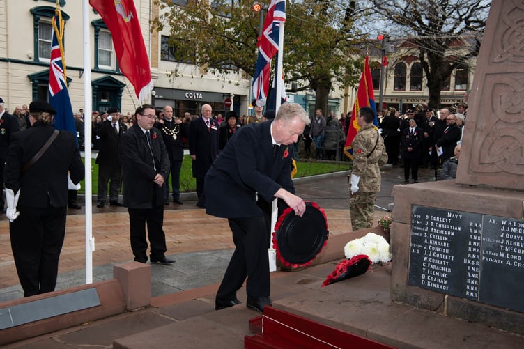 Ramsey MHKs Dr. Alex Allinson and Lawrie Hooper laying a wreath at the service on Sunday, November 10