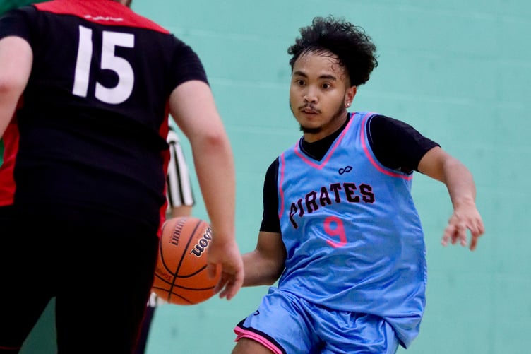 Pirates' Lance Davidas starts a drive to the basket as Ravens' Jake Kinrade shifts to defend at the NSC on Thursday evening (Photo: Martin Dunne)