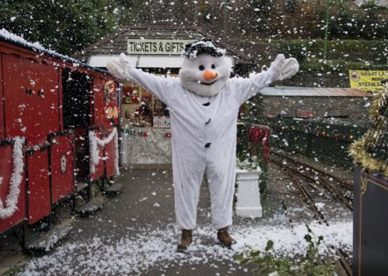 A snowman at the Laxey Christmas Market steam trains