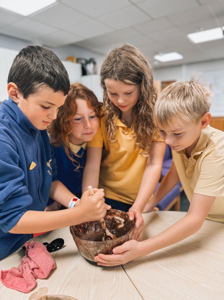 Year four and year five pupils preparing the chocolate brownies