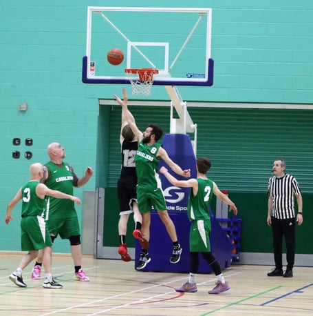 Cavaliers' Phil Evans tries to block a lay-up by a Jets player during Thursday evening's Senior League match-up at the NSC. Evans helped Cavs claim a thrilling 75-73 win 