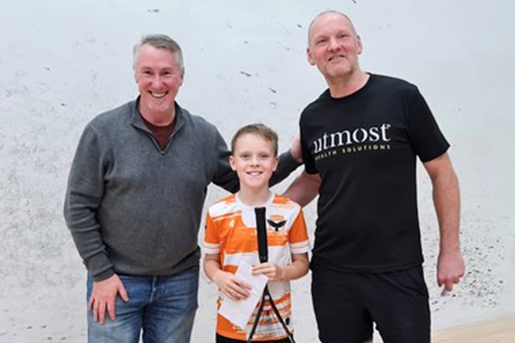 Ryan Visser was the sole junior in the Steve Gaylor Memorial Squash competition and belied his young years to win the E group. He's pictured alongside Global Monetary Solutions' Peter Ferguson and Isle of Man Squash's Dave Freer