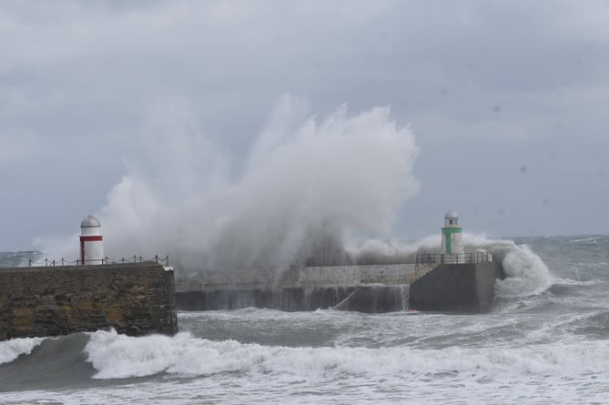 Waves breaking over Laxey Harbour during stormy weather
