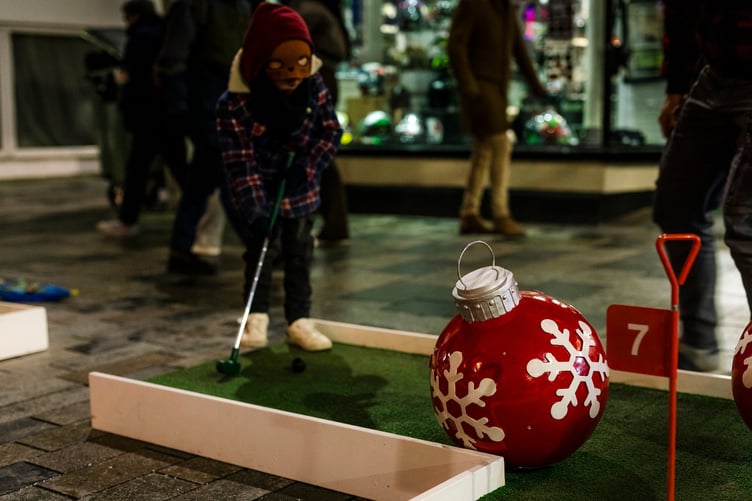 Little ones take part in the Christmas-themed crazy golf