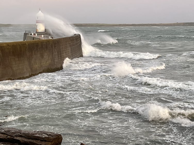 Waves batter Castletown harbour breakwater on Sunday