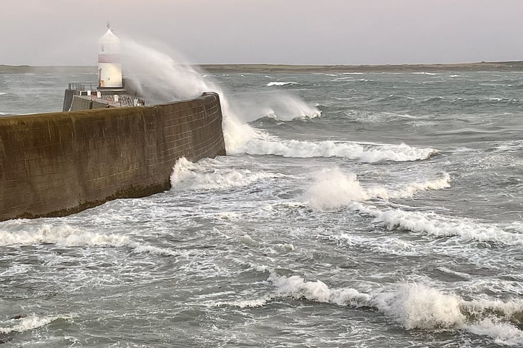 Waves batter Castletown harbour breakwater on Sunday