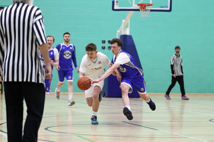 Wolves' Oscar Lace tries to steal the ball from Cannons' Rowan Coulter during Thursday's Senior League match at the NSC (Photo: Darwin Gilmore)