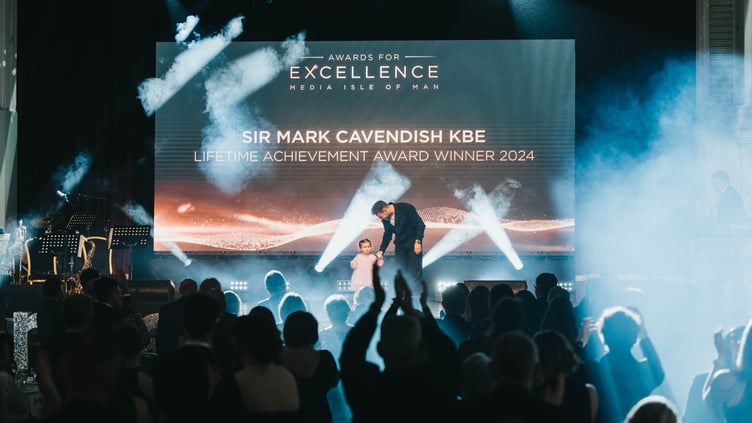 Sir Mark Cavendish KBE with his youngest daughter Astrid after collecting the Lifetime Achievement Award at the Media Isle of Man Awards for Excellence last Thursday