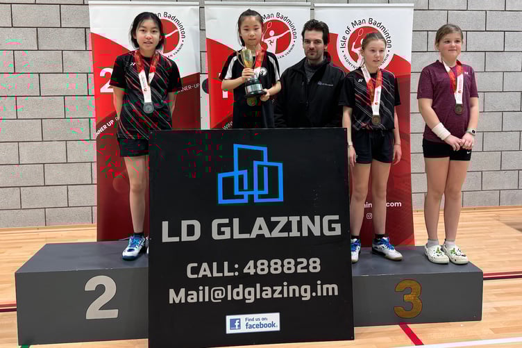 Nine-year-old Sky Yin on the top step of the girls singles podium in the Under-13 Badminton Championships