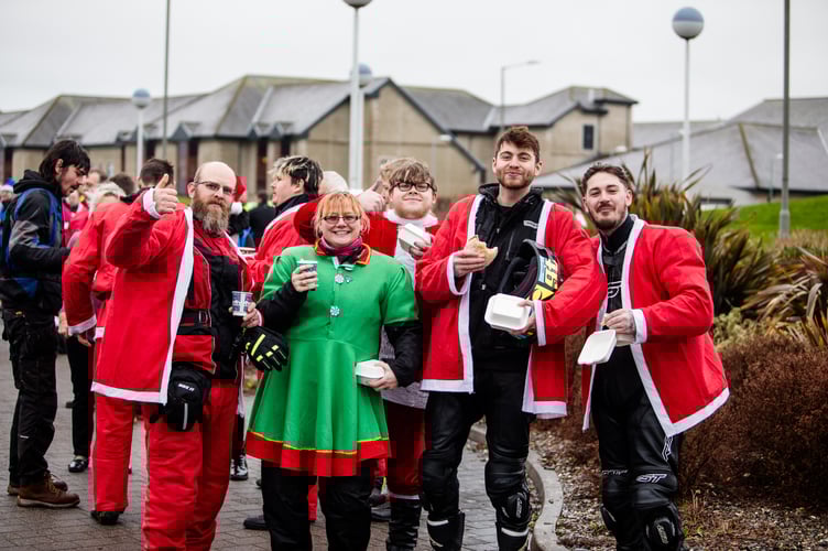 Santa's on a Bike enjoying some food and drink at Rebecca House last year