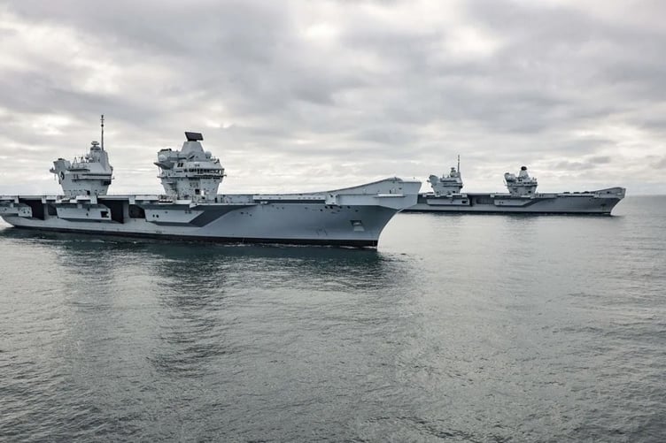 HMS Prince of Wales alongside HMS Queen Elizabeth