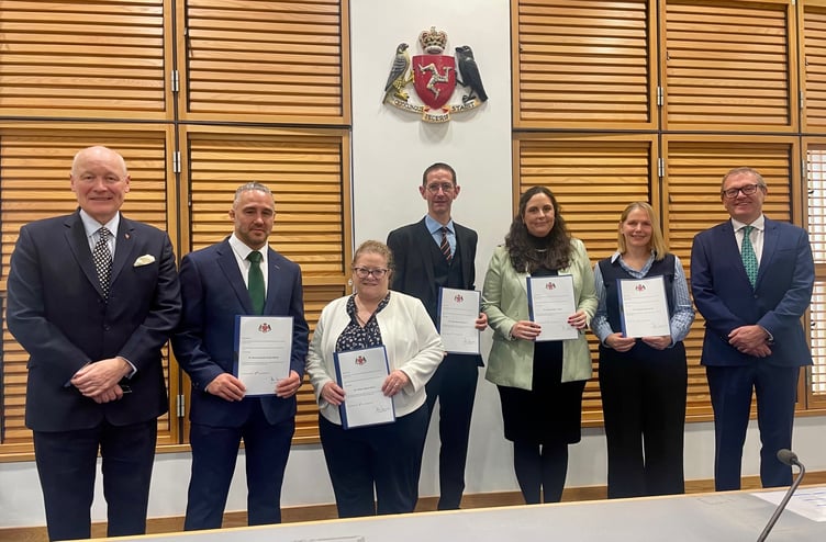 His Excellency The Lieutenant Governor Lt General Sir John Lorimer; newly appointed Magistrates: Daniel Bonett, Gráinne Burns, James Mylchreest, Rachael Cringle and Katie Farrall; and His Honour the First Deemster and Clerk of the Rolls, Deemster Andrew Corlett.