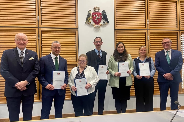 His Excellency The Lieutenant Governor Lt General Sir John Lorimer; newly appointed Magistrates: Daniel Bonett, Gráinne Burns, James Mylchreest, Rachael Cringle and Katie Farrall; and His Honour the First Deemster and Clerk of the Rolls, Deemster Andrew Corlett.