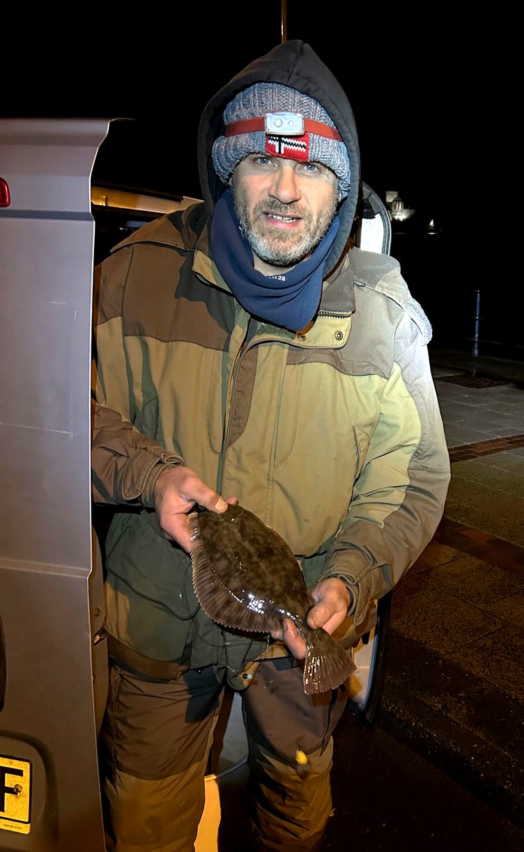 Whittaker Trading Open winner Mikey Cooper with his three-quarter pound flounder which clinched the top prize.