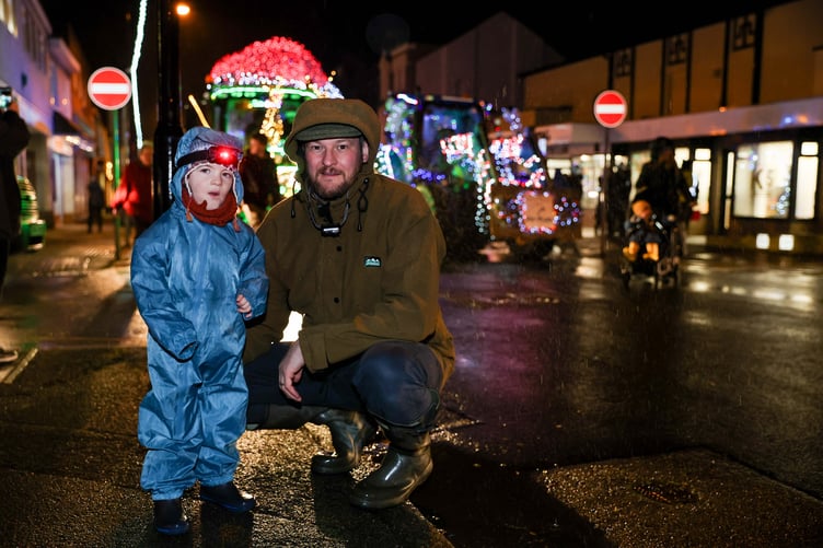Keeping warm on Friday night at the start of the tractor run in Port Erin