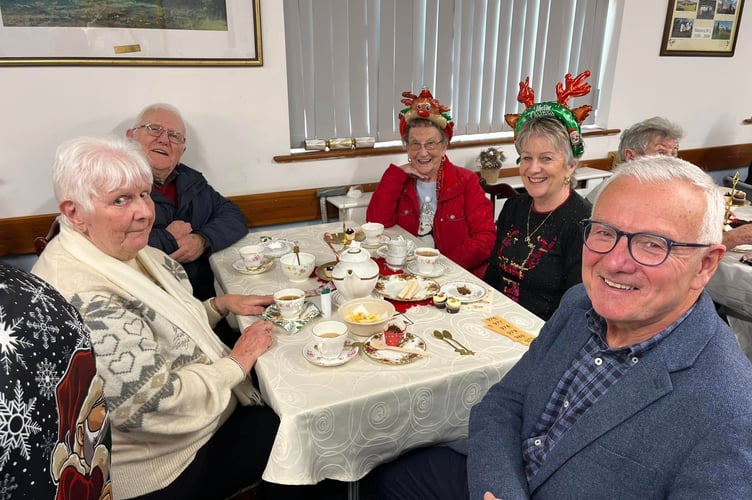 Captain of the Parish of Marown Charles Fargher (right) enjoyed the tea and cakes with well-respected members of the parish 