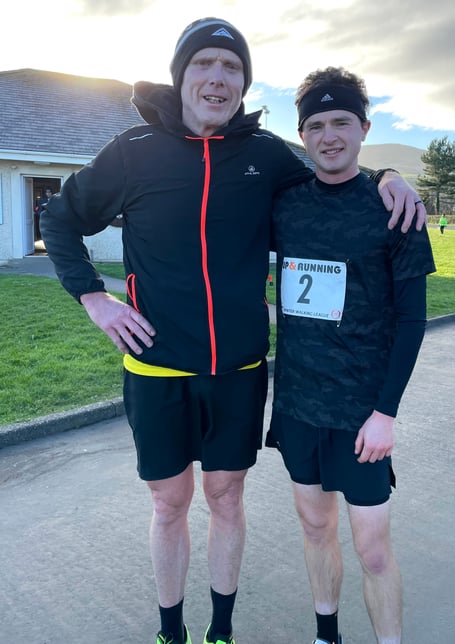 Gianni Epifani (left) and Callum Gawne went toe-to-toe in the 10km race in the third round of Manx Harriers’ Winter Walk Series last weekend. Gawne ultimately edged ahead late on to win by only three seconds (Photo: Graham Young)