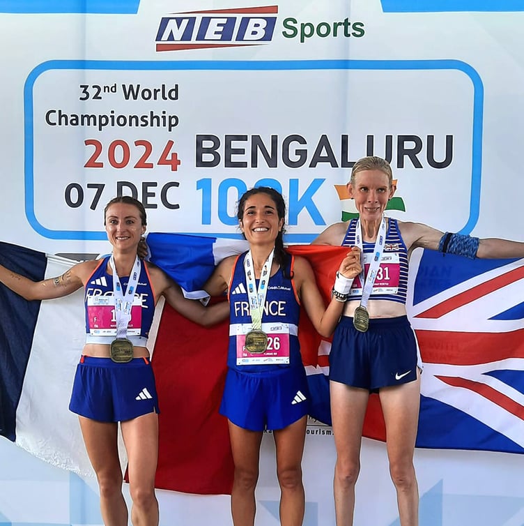 Sarah Webster (right) on the podium at the IAU World Championships in India last weekend after clinching a bronze medal for Great Britain (Photo: IAU - International Association of Ultrarunners)