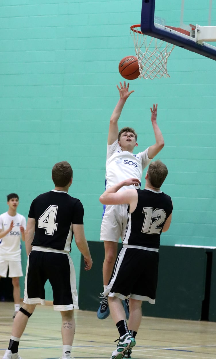 Cannons' Rowan Coulter shoots over the defence of Jets' Kai Kirkham during Thursday evening's league match-up at the NSC (Photo: Martin Dunne)