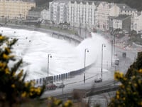 Sandbags deployed as island braces itself for large waves