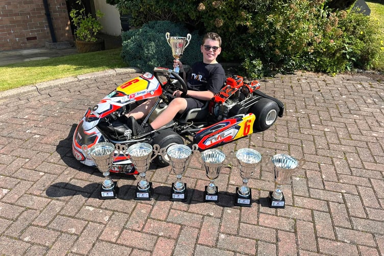 Charlie Gregg with his array of trophies he claimed during this year's SuperOne Series Karting Championship in the UK