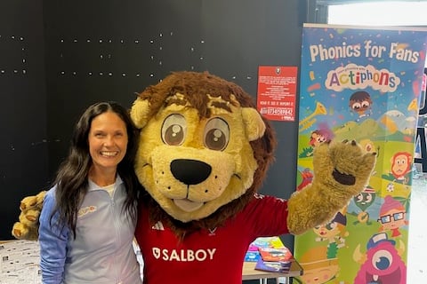 Kathryn Austerberry with Salford City’s 'Billy The Lion' mascot