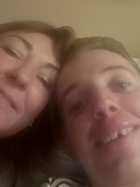 Southern 100 rider Anthony O'Carroll with mum Mary in his hospital bed at Cork University Hospital