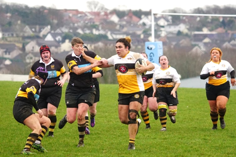 Maylyn Campbell strong arms an opponent at Ballafletcher during Saturday's match. She scored two tries for Vagas against Leight (Photo: John Liver/Mumble's Pics)