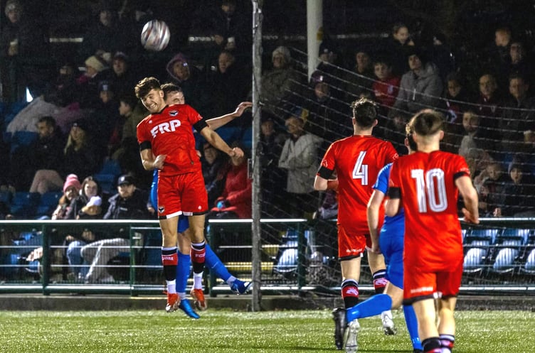 FC Isle of Man's Jacob Crook challenges in the air for a header at the Bowl (Photo: Hannah McHugh)