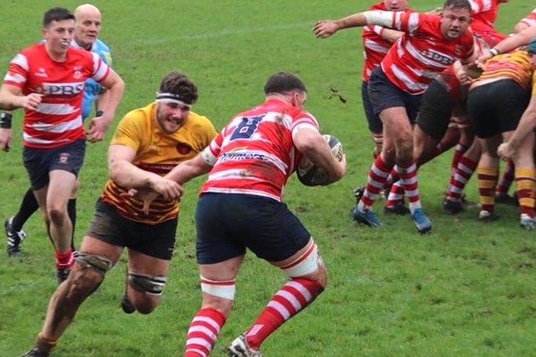 Harry Cartwright (left) hunts down a Vale of Lune opponent during Saturday's match (Photo: Thomas Bradburn)