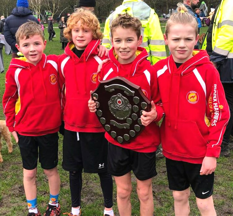 The Manx Harriers' under-11 boys team that competed in the Lancashire Cross-Country Championships in Blackburn on Saturday. (Left to right) Austin Quaye, Bobby Teare, Leighton Curphey and Henry Quaye. Leighton is holding the Red Rose League shield he won before Christmas which was presented to him straight after the under-11 boys race on Saturday, which he also won (Photo: Steve Partington)