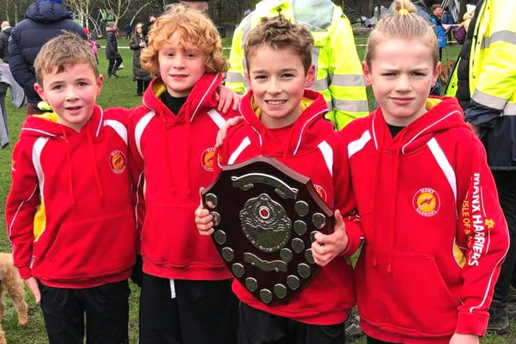 The Manx Harriers' under-11 boys team that competed in the Lancashire Cross-Country Championships in Blackburn on Saturday. (Left to right) Austin Quaye, Bobby Teare, Leighton Curphey and Henry Quaye. Leighton is holding the Red Rose League shield he won before Christmas which was presented to him straight after the under-11 boys race on Saturday, which he also won (Photo: Steve Partington)