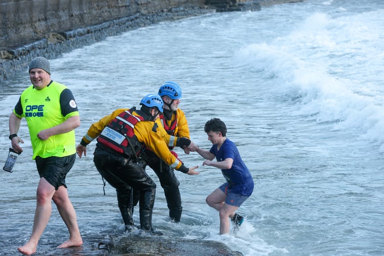 Port Erin Coastguards giving a hand to a young dipper at Chapel Beach