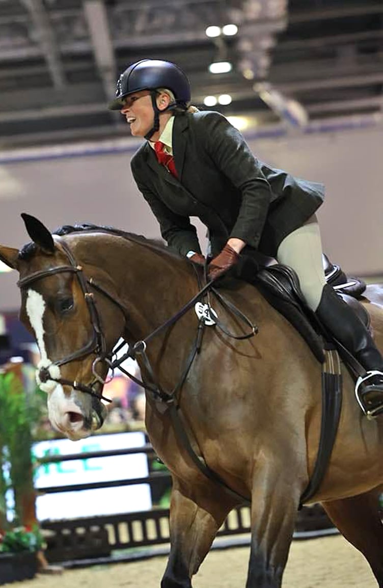 Anna Higgins and Millmount Maestro on their way to triumphing at the London International Horse Show recently (Photo: Real Time Imaging)