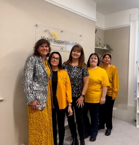 Members of Victim Support IoM wearing yellow for Dress in Yellow Day