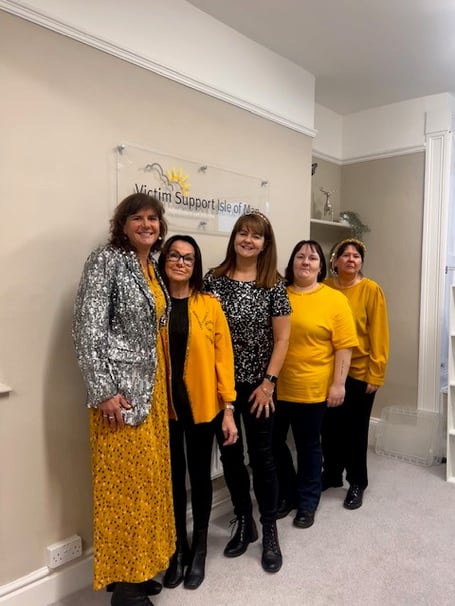 Members of Victim Support IoM wearing yellow for Dress in Yellow Day