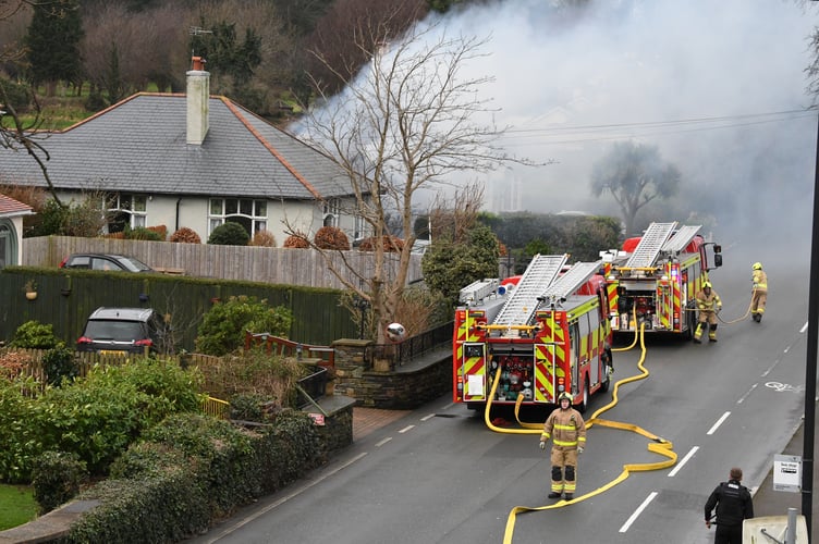 Two fire engines can be seen at a property on Lezayre Road