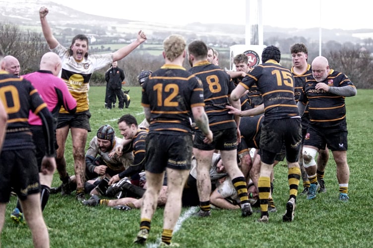 Vagabonds' Aaron Sloane celebrates as one of his team-mates dives over the line to score a try during their 26-16 victory over Orrell at Ballafletcher (Photo: John Liver/Mumble's Pics)
