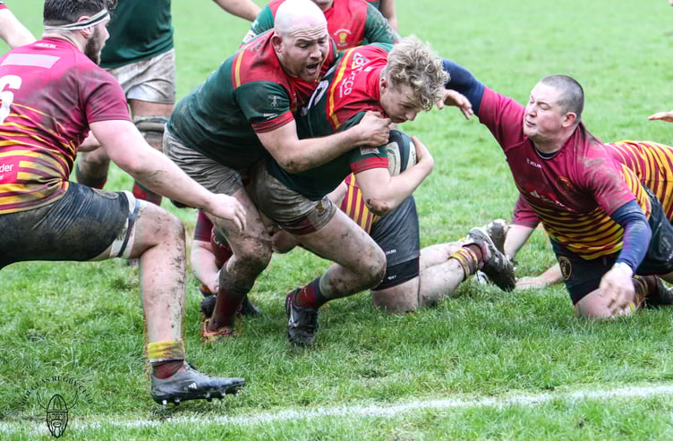 Harry Cartwright and Bryn Snellgrove are unable to prevent Max Beadle from scoring a try for Sandbach during Saturday's match at Port-e-Chee (Photo: Richard Ebbutt)