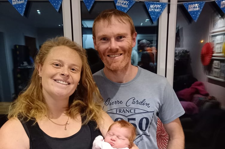 Doting parents Claire Kelly and Ian Moore with baby Tamzin Kelly Greeba Moore taken less than 48hrs after her birth in a car at Greeba Bridge