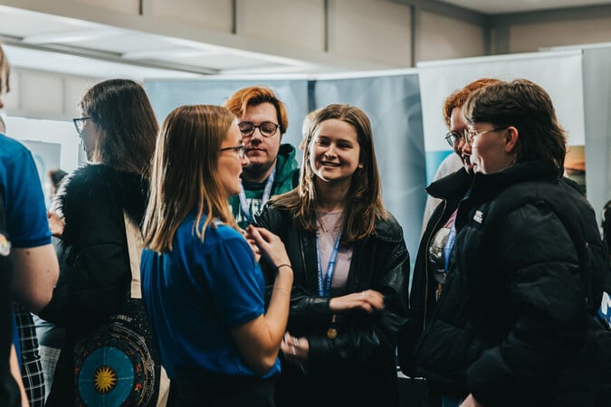 Zurich team speaking with event attendees in 2024