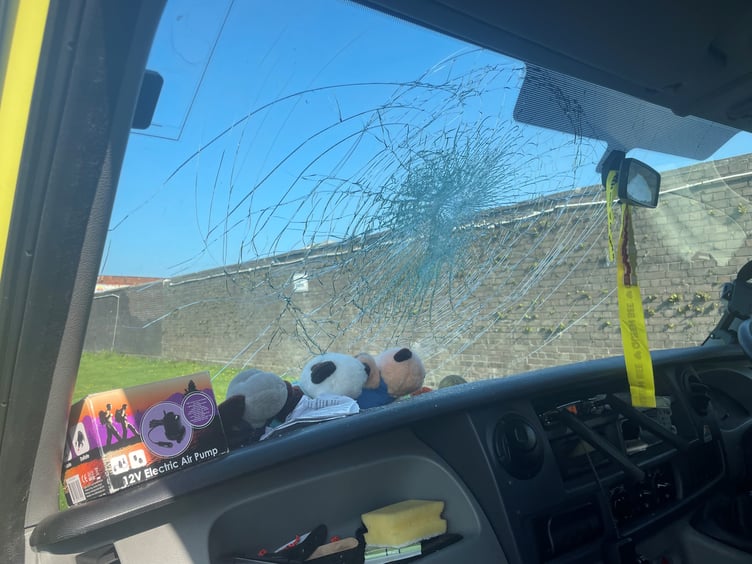 The smashed windscreen of the victim's campervan