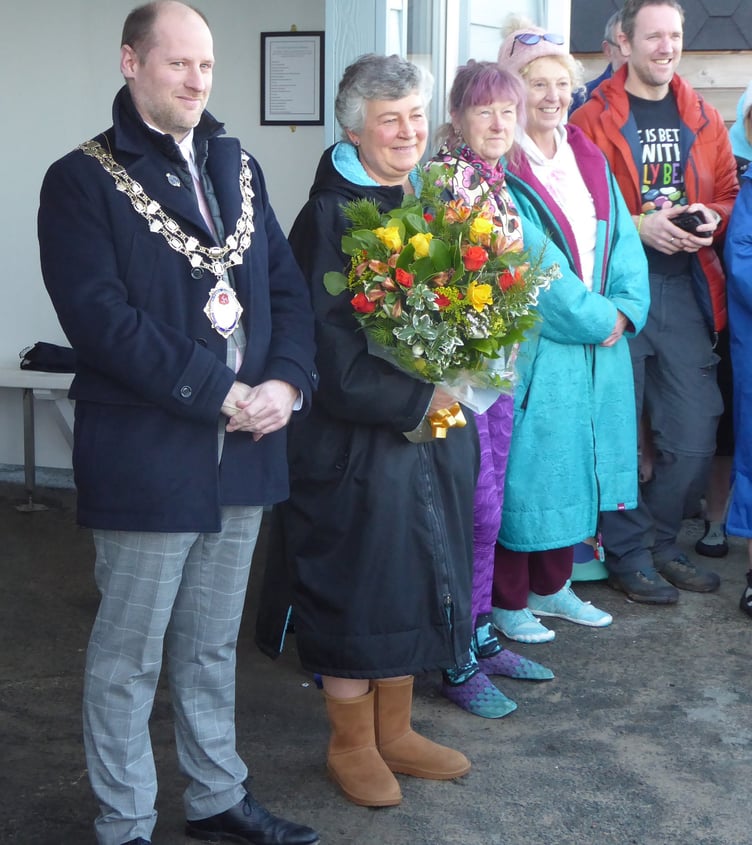 Lady Lorimer with a bouquet of flowers to mark the opening