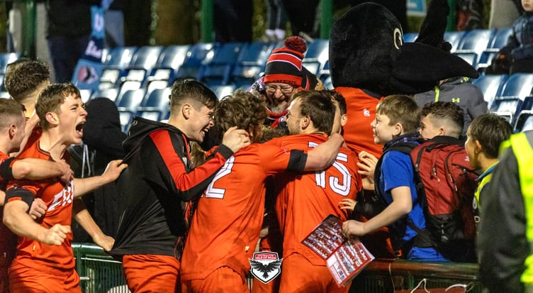 FC Isle of Man players and fans celebrate wildly after Ste Whitley's dramatic 98th minute winner against AFC Liverpool at the Bowl on Saturday evening (Photo: Hannah McHugh)